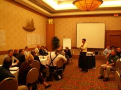 Photo of instructor and conference attendees.