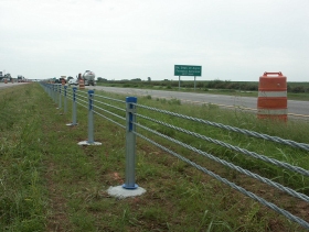 A high-tension four-strand cable median barrier is shown