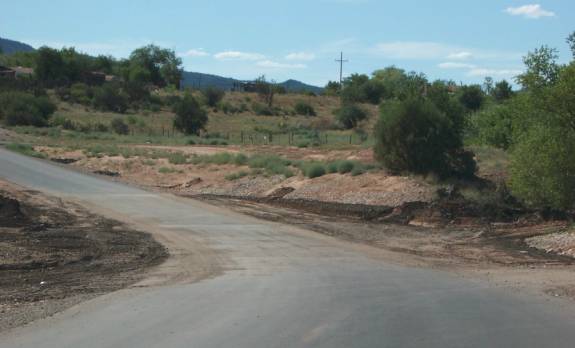 photo of a road with signs of low water crossing