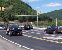 Photo of traffic flowing at the new signalized intersection of SR 61 and the Connector road just north of the bridge.