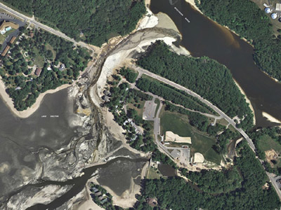 Devastation of washed out Trunk Highway A and empty lake