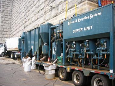 A compressor, vacuum, and paint chip collection equipment located as close to an existing wall to shield noise to nearby receptors. 