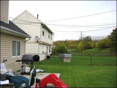 A noise analysis using a sound level meter in the back yard of a resident to establish pre-construction background noise levels.