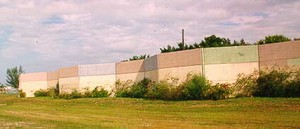 Photo of a pre-cast concrete free standing noise barrier