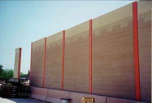 Photo of a noise barrier that uses color to create a pattern of a castle wall