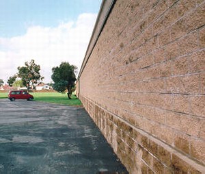 Photo of a masonry block noise barrier with a manufactured finish