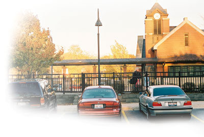 Photo of three cars in a parking log