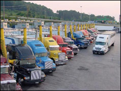 Photo of trucks lined up at a truck stop