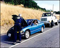 Man aiding motorist with car hood open