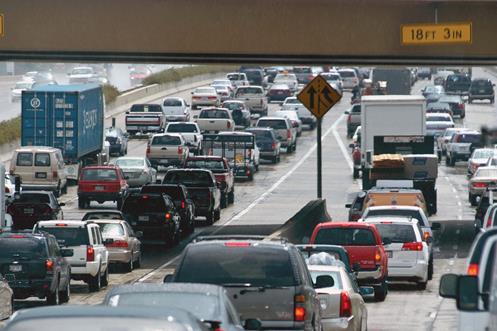 Photo of a highway with heavy traffic.