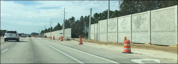 Photo of nearly-completed barrier at the entrance to Highlands Reserve along US 27 in Davenport, FL 