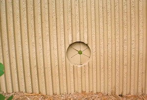 Photo of a noise barrier with a firehose access opening