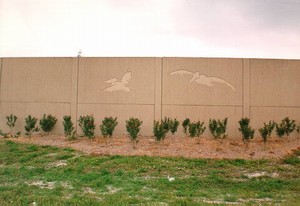 Photo showing a pattern on the noise barrier surface outlining large waterfowl