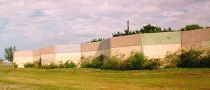 Photo of a noise barrier with a different colored panels