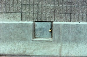 Photo of a noise barrier with a firehose access opening