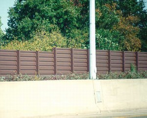 Photo of a metal noise barrier with horizontal texture showing how easy it may be to climb the barrier