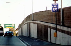 Photo of a cast-in-place concrete noise barrier retaining wall combination