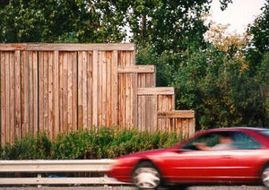 Photo showing noise barrier end treatment with panels stepping down 