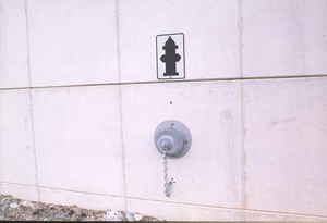 Photo of a noise barrier with a firehose connection