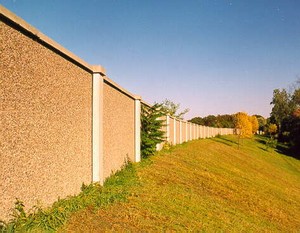 Photo of a post and panel noise barrier