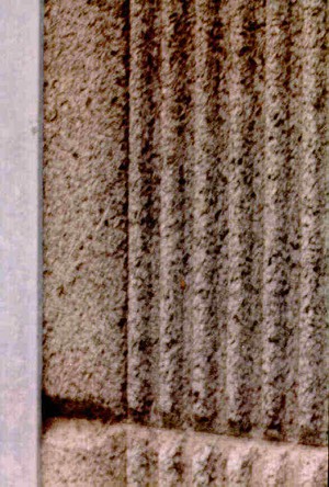 Photo of a pre-cast concrete noise barrier with absorptive rubber surface treatment