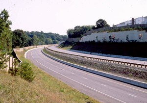 Photo of a noise barrier at the top of a slope