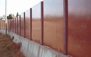Photo of a noise barrier with a high sheen that may result in glare.