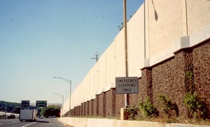 Photo of a cast-in-place concrete noise barrier retaining wall combination