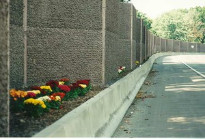 Photo of a noise barrier illustrating integration of the noise barrier with supplemental vegetation.