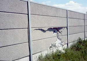 Photo of a damaged noise barrier intended to illustrate maintenace considerations