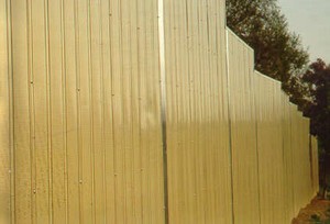 Photo of a metal noise barrier with vertical texture