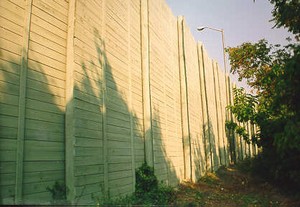 Photo of a wooden noise barrier with horizontal planks