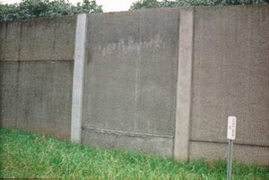 Photo of a natural concrete smooth finished noise barrier