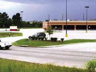 low density commercial space is buffer between roadway and residential development