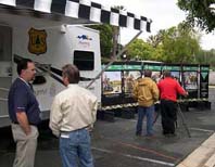 Photo of a trailer vehicle used as a contact point, display, and mini classroom.
