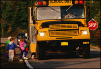 Photo of children boarding a school bus