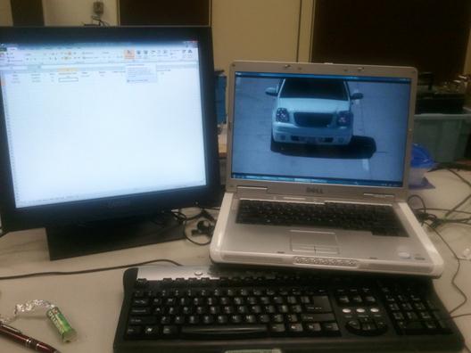 Dual-monitor computer setup for license plate number extraction