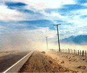 The third image is a small dust cloud (fugitive dust from vehicles) over a two-lane road in Nevada. 
