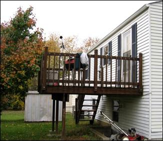 A noise analysis using a sound level meter is performed on an elevated deck extending off a nearby home; this is the area of frequent human use and is thus the receiver location.