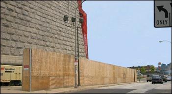 An existing structure, 4 stories tall, and plywood on chain link fence shield a construction site â€“ one baffled, shielded compressor is visible.