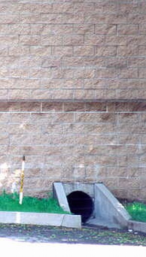 Photo of a noise barrier with culvert underneath the barrier