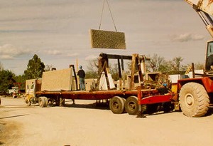 Photo showing delivery and unloading of pre-cast concrete noise barrier panels