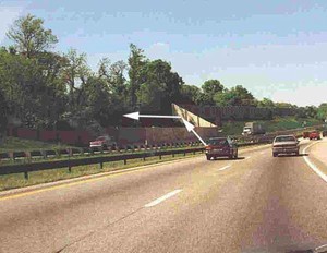 Photo showing a transition in noise barrier alignment and possible flanking reflections due to lack of shielding