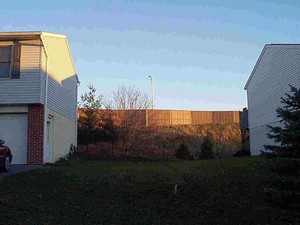 Photo from the back of a noise barrier illustrating the importance of color when seen from adjacent land uses