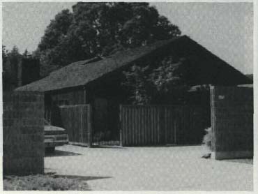 Photo of a suburban home with a car in the driveway.