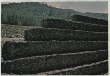 Gabions may be stacked in a variety of ways to construct a wall.