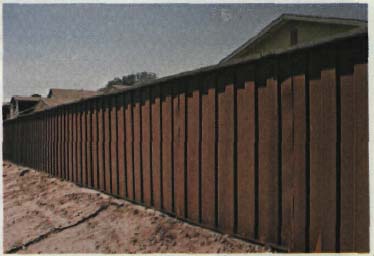 A Corten steel corrugated wall which rusts to a natural wood color