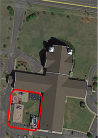Title: Outdoor area that is physically shielded - Description: An aerial view of an outdoor activity area that is physically shielded from the traffic noise by the adjacent building.