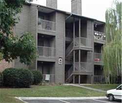 Title: Multi-family apartment/condominium - Description: The front of a multi-family apartment/condominium with upper floor units.