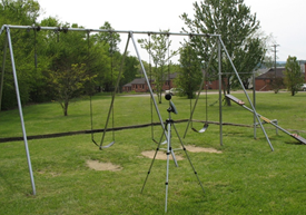 Title: Measurement in a neighborhood common area - Description: A sound level meter measuring sound level near a common play area within a neighborhood.